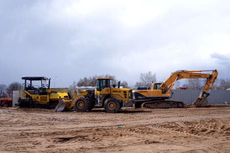 large crawler excavators standing at a construction site. excavators and bulldozers. Smolevichi,...