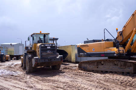large crawler excavators standing at a construction site. excavators and bulldozers. Smolevichi,...