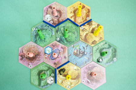 The tiles and meeples of tabletop board game Takenoko. Popular family hobby strategy board game....
