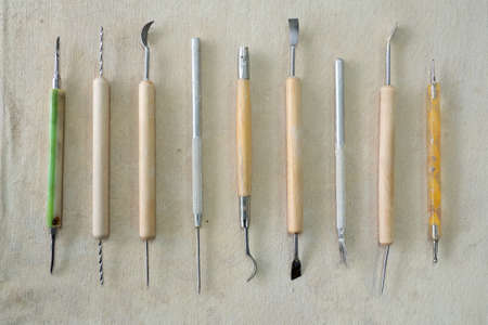 Pottery craft tools for sculpting clay art. View from above