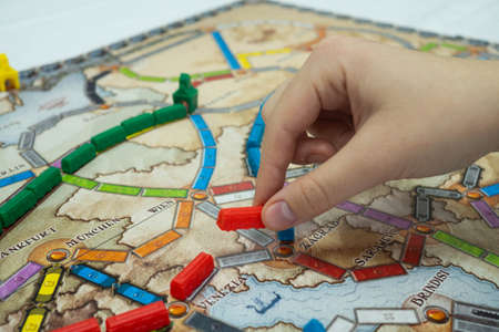 Minsk, BELARUS - November 3, 2021: Strategic board game ticket to ride with trains, trade and...