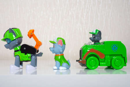 Minsk, Belarus - January 9, 2022: Paw patrol team. Different miniatures of hero Rocky with green recycle truck.のeditorial素材