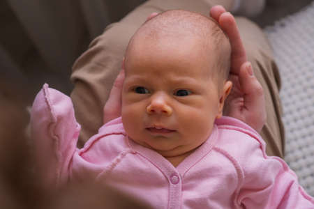 Portrait of caucasian cute little infant girl. healthy one month baby