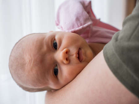 Portrait of caucasian cute little infant girl. healthy one month babyの写真素材
