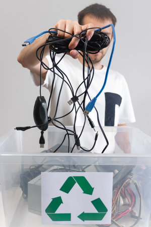 Hazardous E-Waste Recycling. Household electrical and scrapped electronic devices in recycle box....