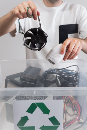 Hazardous E-Waste Recycling. Household electrical and scrapped electronic devices in recycle box....