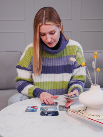 Psychotherapist using Metaphorical associative cards on psychological reception. alternative methods of psychotherapy. projective psychological technique. Minsk, Belarus, January, 16, 2023のeditorial素材