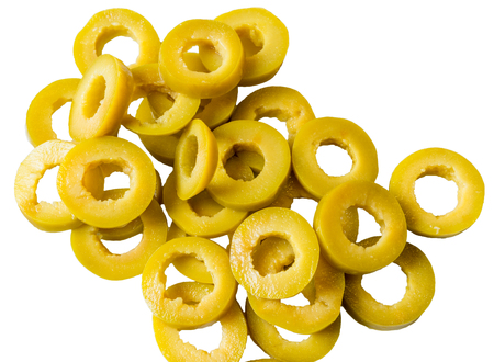 sliced green olives on a white background closeup.の写真素材