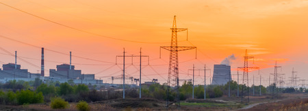 Power Plant at sunset with cloudy sky.