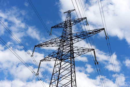 Electricity pylon against the blue sky background.の写真素材