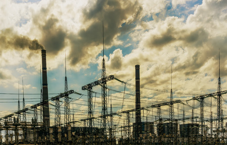 coal power plant with big chimneys and electrical substation on the frontの写真素材