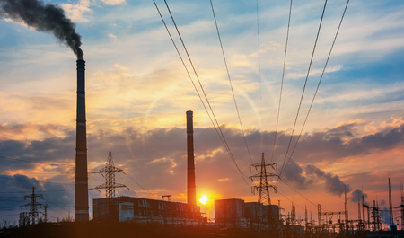 Power station at dusk and power lines.の写真素材