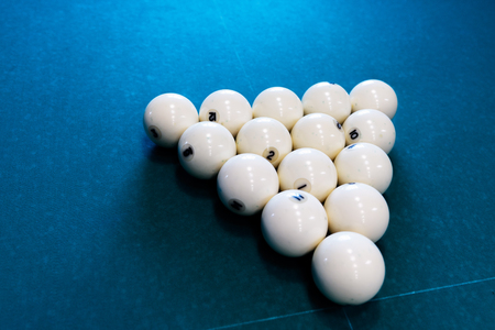 eight white billiard ball on a pool table