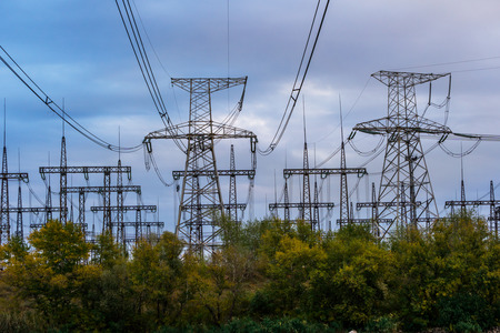 Electrical substation and pylons on the sunset background