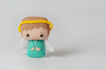 angel of felt on a light background. Handmade, interior toyの写真素材