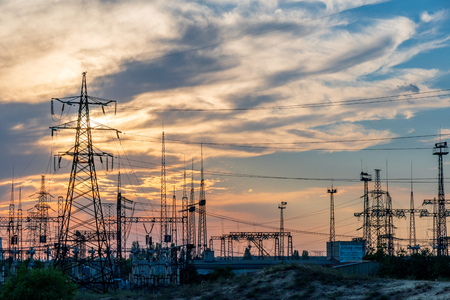 High-voltage  power lines. Electricity distribution station. high voltage electric transmission tower. Distribution electric substation with power lines and transformers.の写真素材