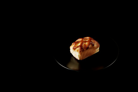 Tasty homemade pie with forest fruits on black background. Food close up.の写真素材