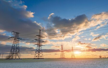 Power lines during a beautiful winter sunset