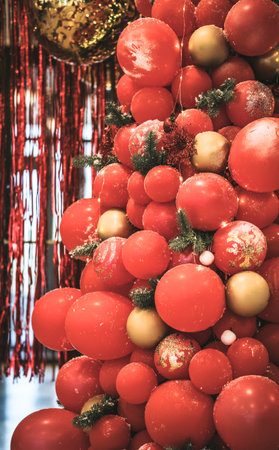Christmas tree made of red balloons with decor, close up.の写真素材