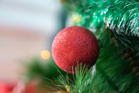 Christmas tree decorated with red ball, close up.の写真素材