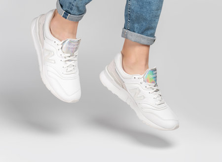 Kiev, Ukraine - January 03, 2021: White women's casual sneakers from New Balance brand on a light...