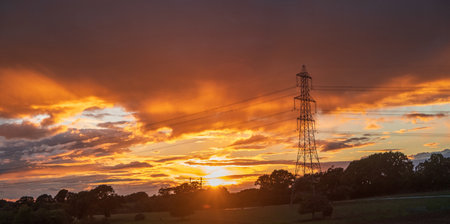 Power line silhouette on colorful sunset backgroundの写真素材
