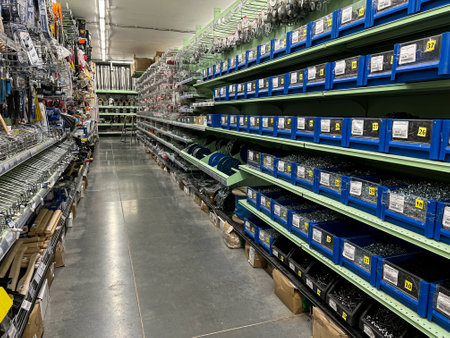Shelves with different goods in hardware store