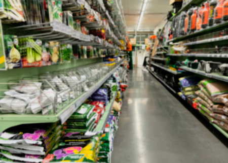 A blurry image of a hardware store with paints, varnish, brushes in a building materials store as a trading background. For the design.の写真素材