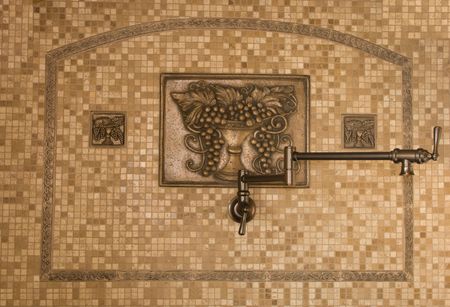New kitchen decor of marble tiles and bronze embossed platesの写真素材