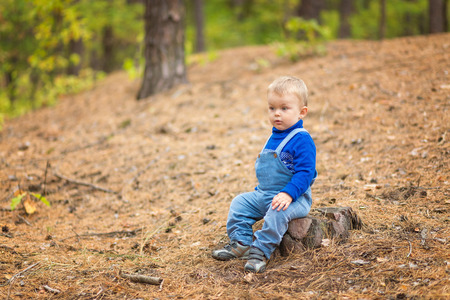 baby boy in a forestの写真素材