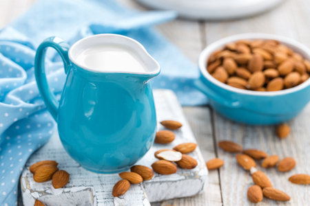 Fresh almond milk and nuts, vegan drinkの写真素材