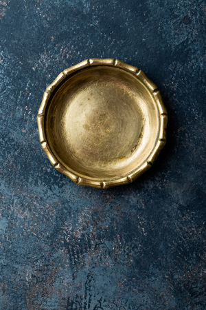 Empty metal plate on dark texture background top view, copy spaceの写真素材