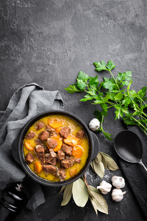 Meat stew, goulash in a cast iron pot, top viewの写真素材