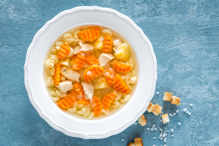Chicken soup, boullion with meat, pasta and vegetablesの写真素材