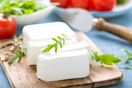 Feta cheese on boardの写真素材