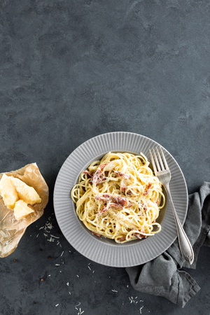 Carbonara pasta, spaghetti with pancetta, egg, hard parmesan cheese and cream sauce. Traditional italian cuisine. Pasta alla carbonaraの写真素材