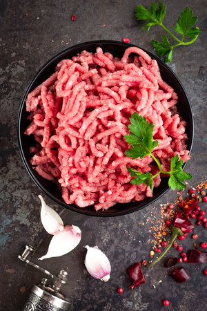 Raw ground beef meat with ingredients for cooking. Fresh minced meatの写真素材