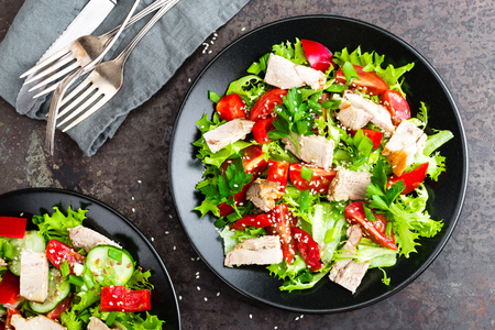 Salad with meat. Fresh vegetable salad with baked meat. Meat salad with fresh vegetables on plateの写真素材