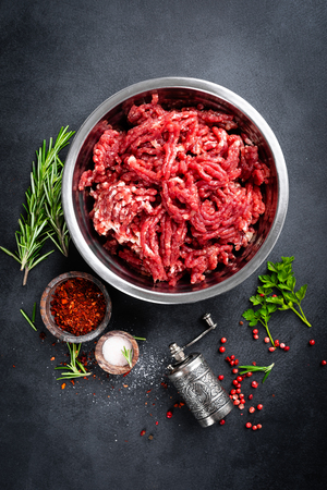 Mince. Ground meat with ingredients for cookingの写真素材