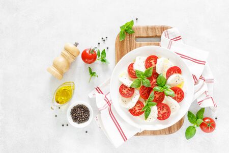 Fresh italian Caprese salad on white plate, view from aboveの写真素材