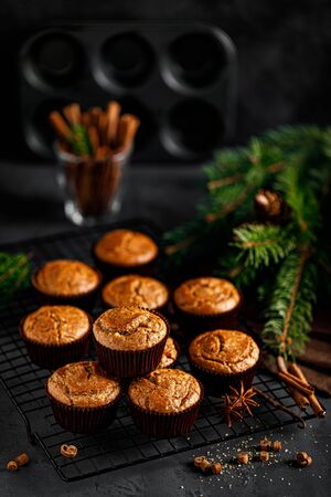 Christmas cinnamon muffins on black backgroundの写真素材