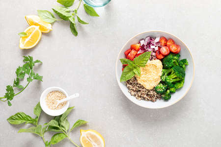 Vegetarian Buddha bowl with quinoa, vegetables and hummus, healthy food conceptの写真素材