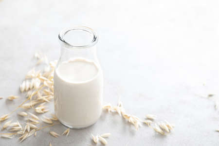 Oat milk. Delicious and healthy vegetarian alternative milk drink. Non-dairy milkの写真素材