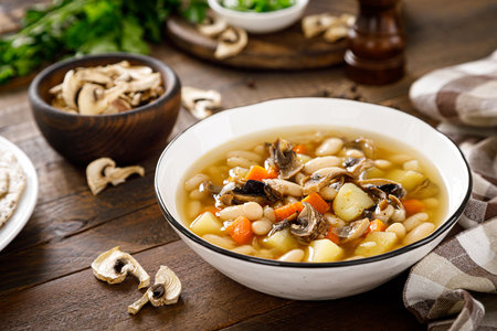 Mushroom soup with kidney bean, potato and carrotの写真素材