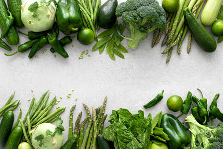 Green vegetables. Fresh green produce. Natural plant based eating. Healthy vegetarian food concept background. Flat lay. Top down viewの写真素材
