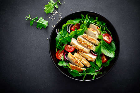 Grilled chicken breast and salad.