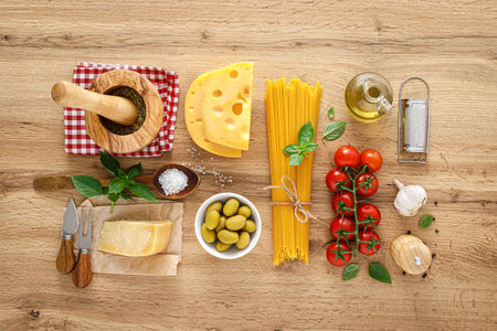 Italian food. Culinary concept background with ingredients for cooking on wooden kitchen rustic table, top view with copy space. Ingredients for cooking pasta.の写真素材
