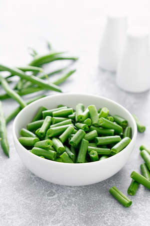 Fresh raw green beans cut in a bowl. French green beans