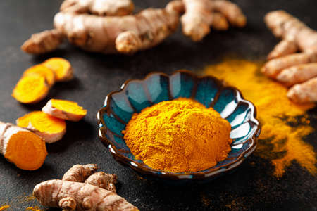 Turmeric. Fresh turmeric root and turmeric, curcumin powderの写真素材