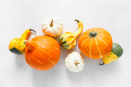Pumpkins on white background. Autumn, fall, thanksgiving or halloween concept, flat lay, top view,...